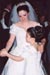 Bride and flower girl dancing